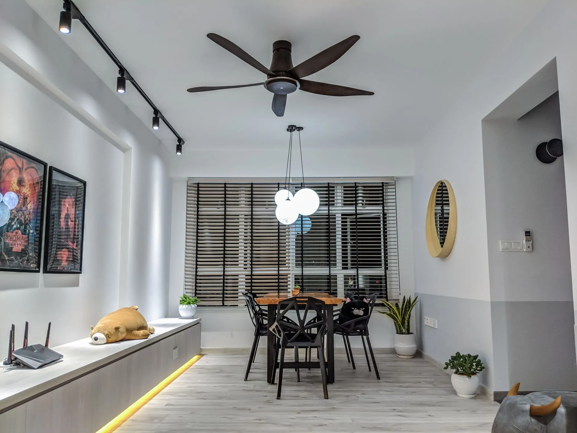The living room. We don't typically turn on all the lights, the LED lights beneath the settee isn't really useful. It's primarily for aesthetic purposes. The 60-inch ceiling fan fits quite well, we were originally concerned that it'd be too big. But it's just right.